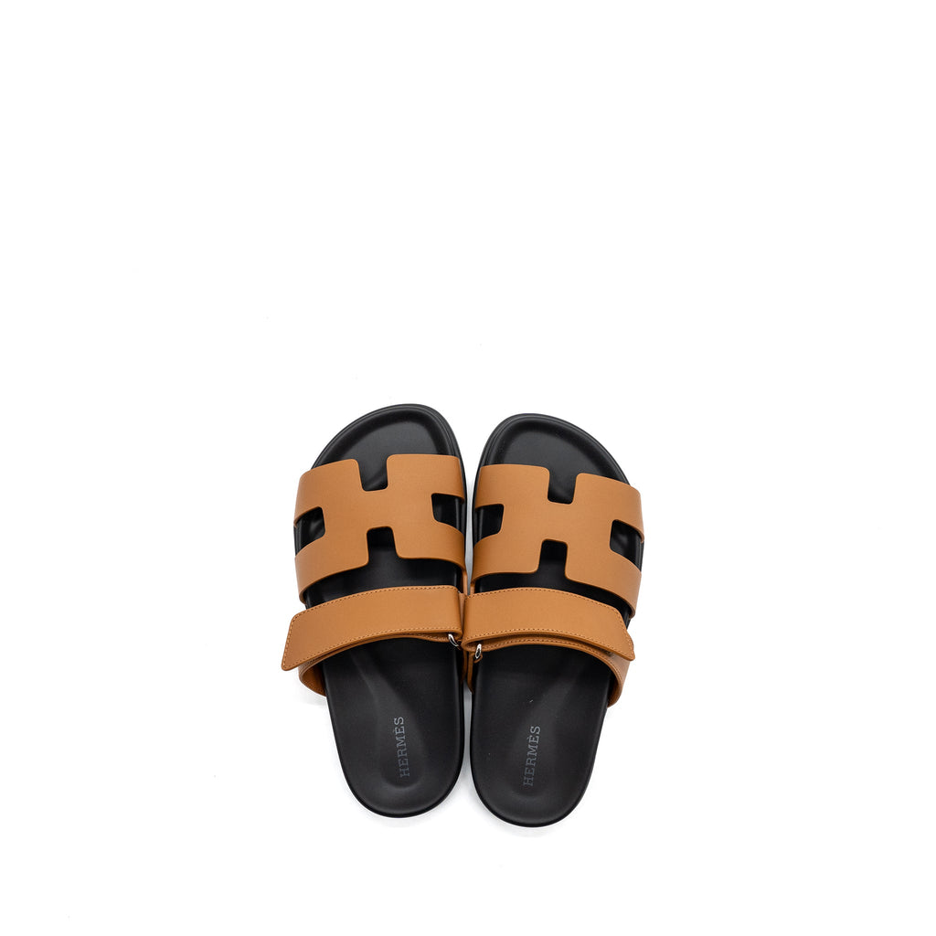 HERMES CHYPRE SANDALS GOLD / BLACK
