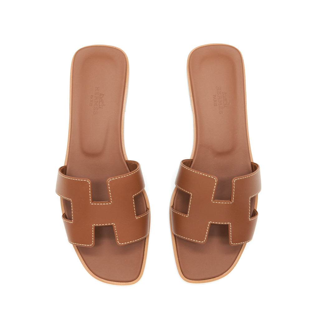 HERMES ORAN SANDALS GOLD