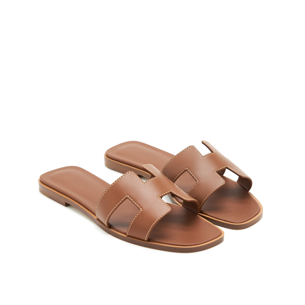 HERMES ORAN SANDALS GOLD